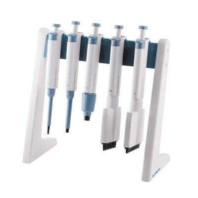 Laboratory stand with five multichannel pipettes in a row on a white base.
